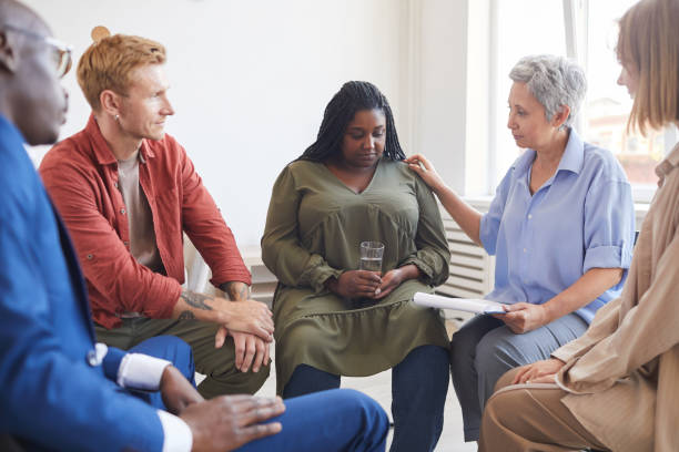 Portrait of young woman sharing struggles during a substance use intervention support group meeting