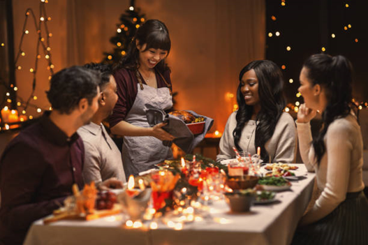 A group of friends gathers for a holiday dinner.